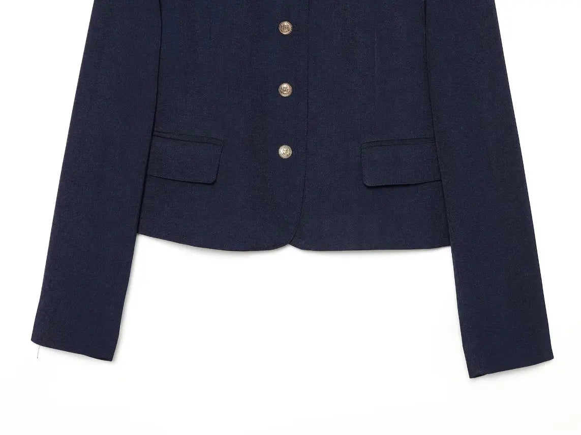 Close-up of flap pockets and gold button placket