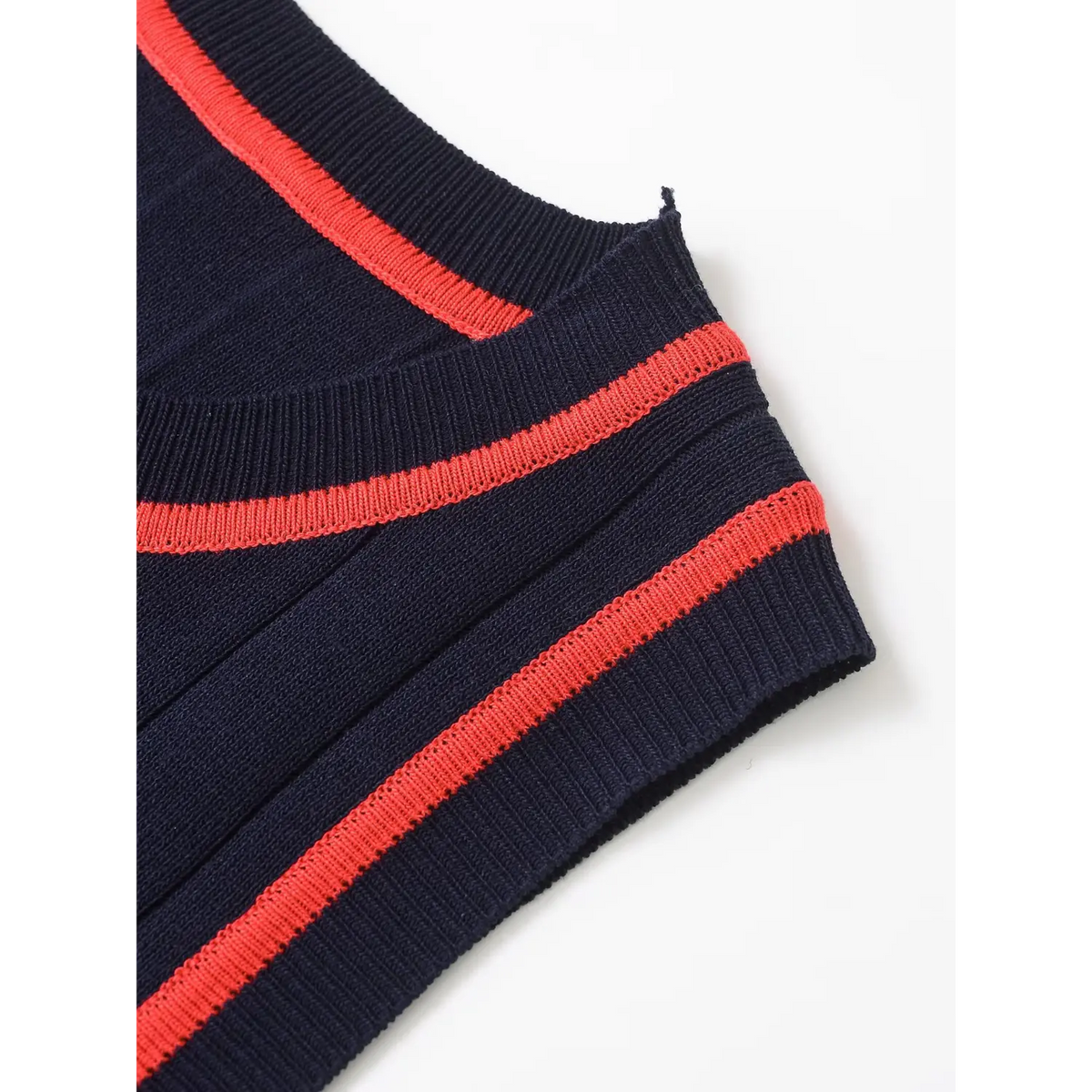 Close-up of red contrast trim at neckline and armhole