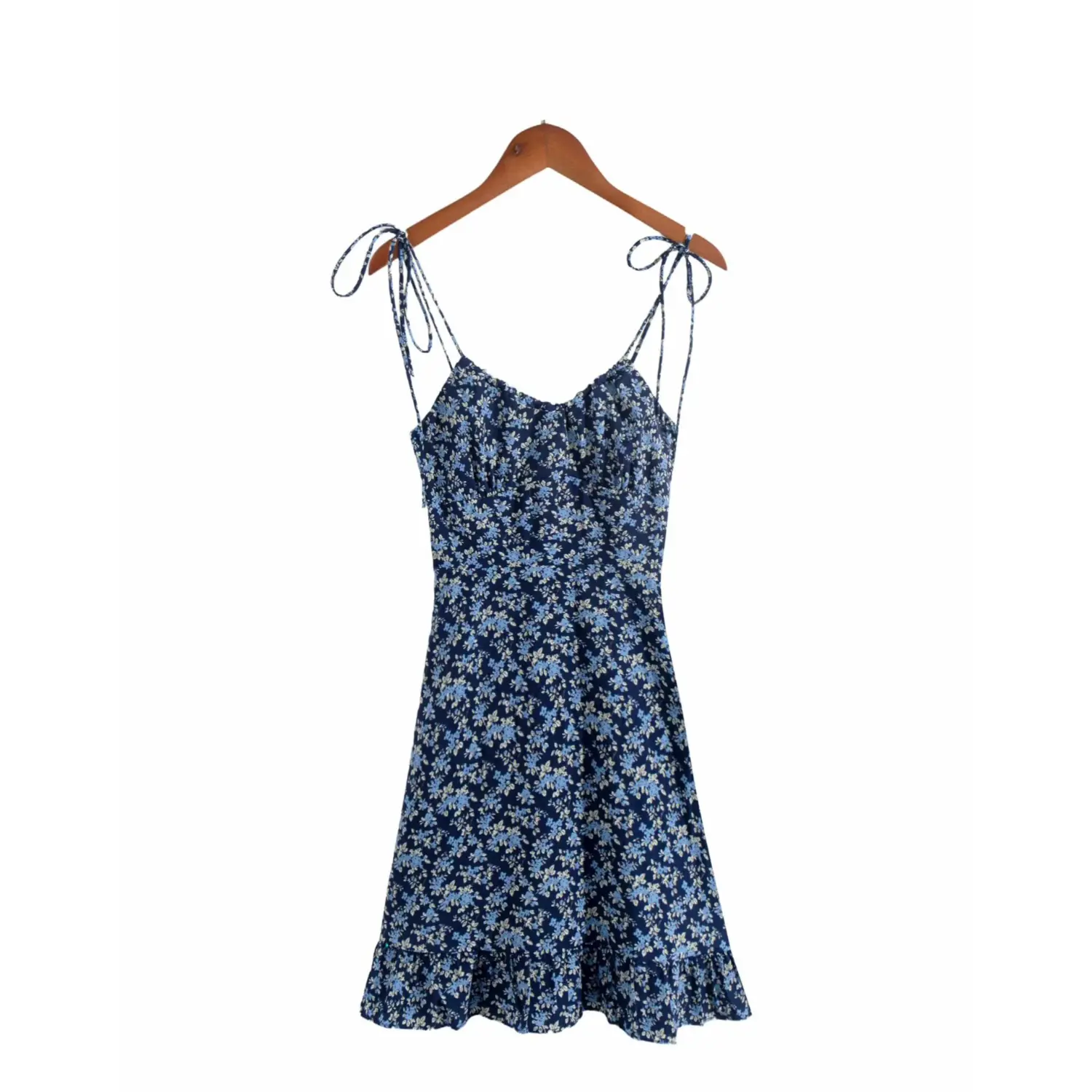 Full front view on white background of the navy blue floral spaghetti strap dress