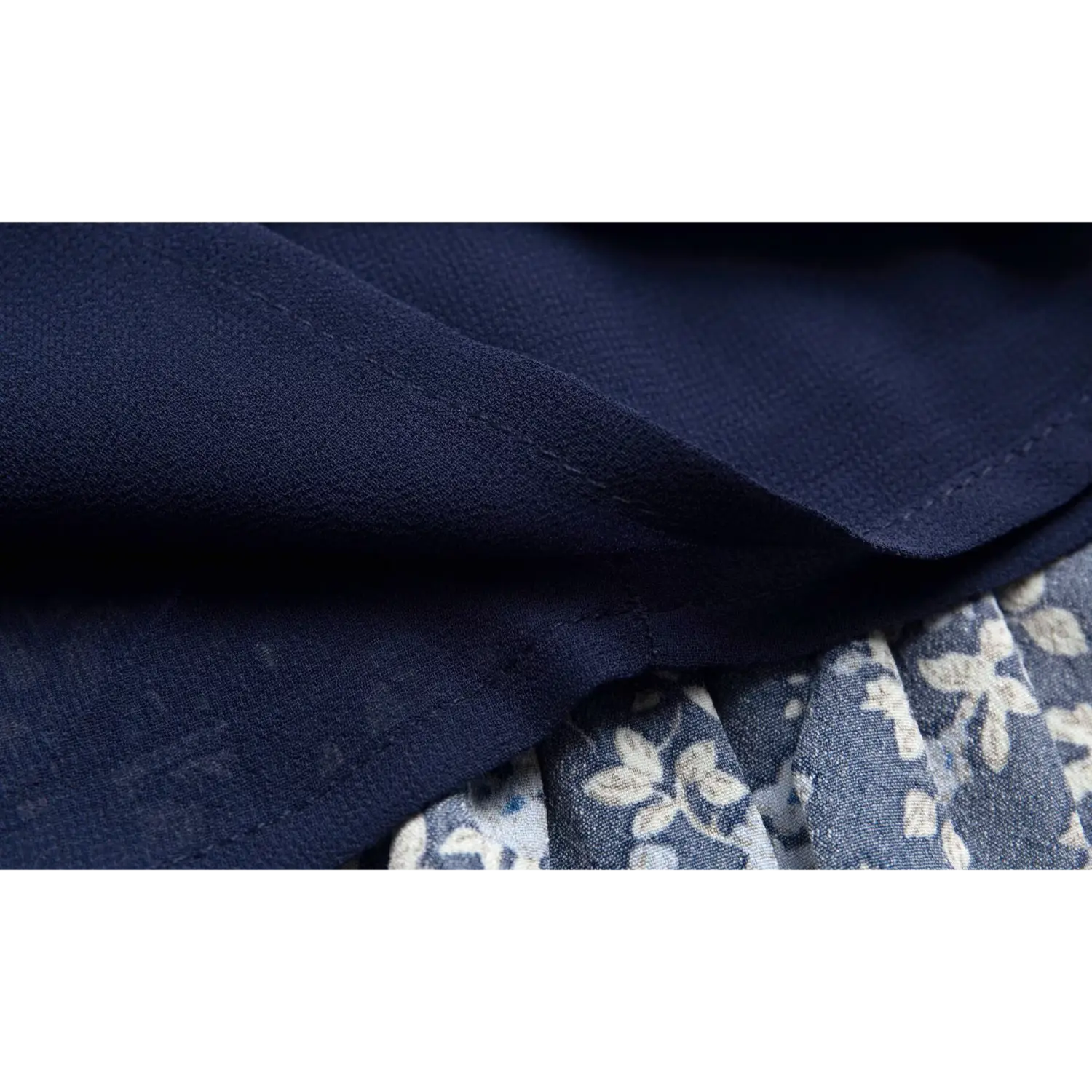 Close-up of the finished lining hem on the navy blue floral dress