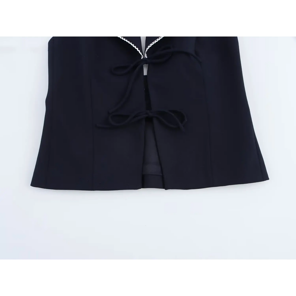 Close-up of two front tie bows and hem