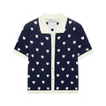 Full studio shot of navy heart print knit polo top, showing the contrast trim and button placket.