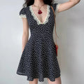 Navy lace puff sleeve polka dot mini dress model wear shot, V neck eyelash lace front flower button short bubble sleeves high waist A-line skirt french vintage daily date outfit display
