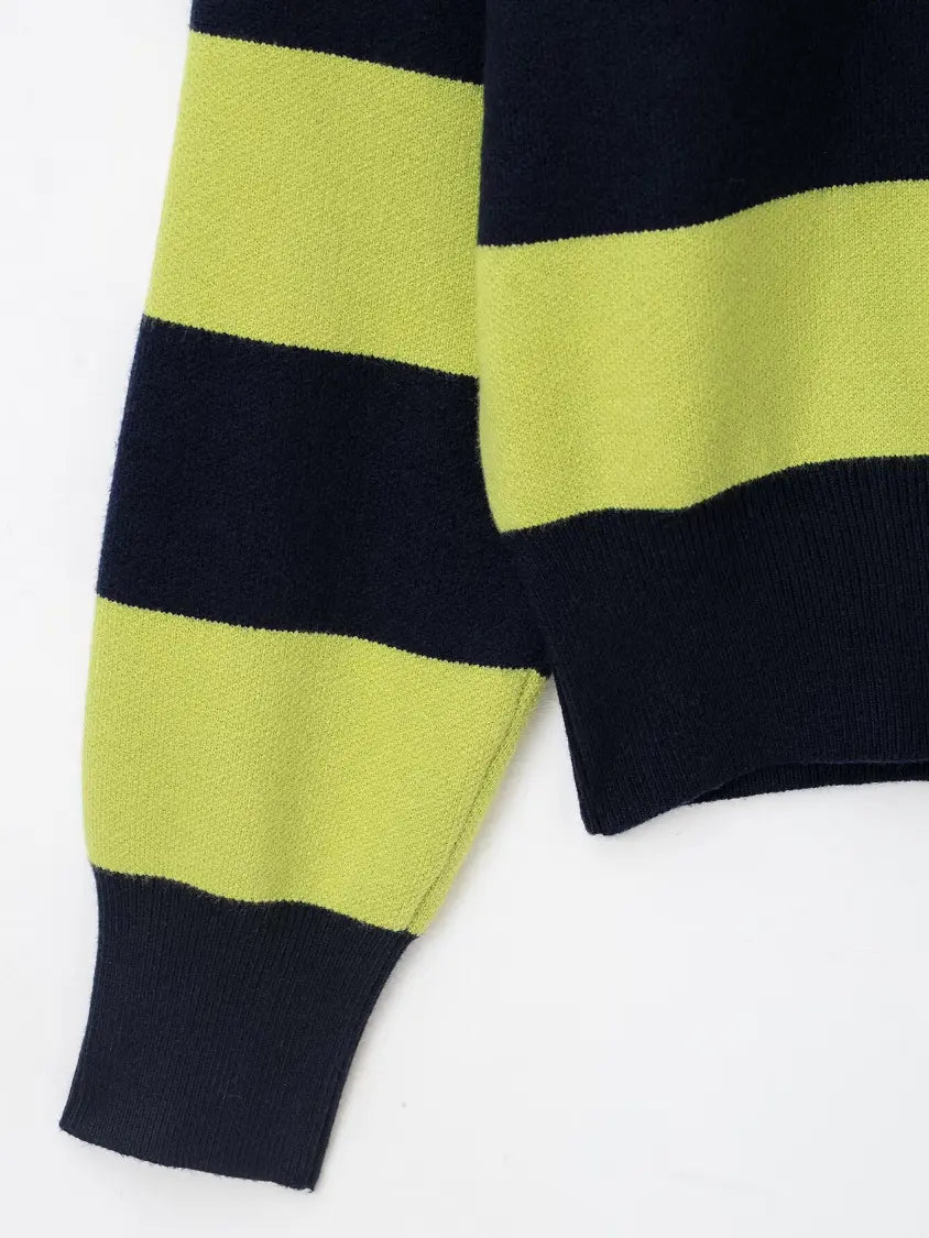 Close-up of ribbed cuff and sleeve stripe detail