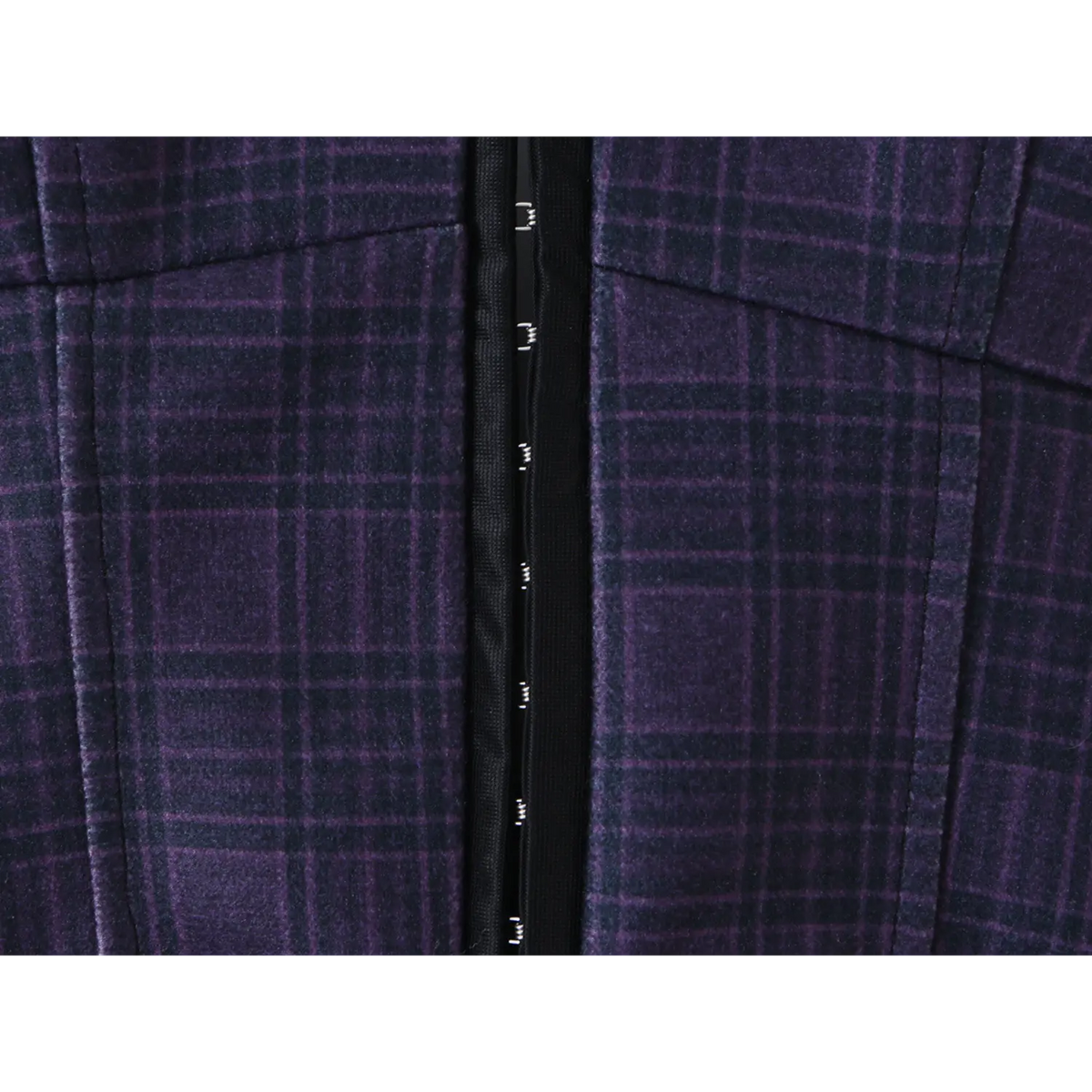 Macro shot of front hook eye closure on corset bodice of navy plaid halter mini dress