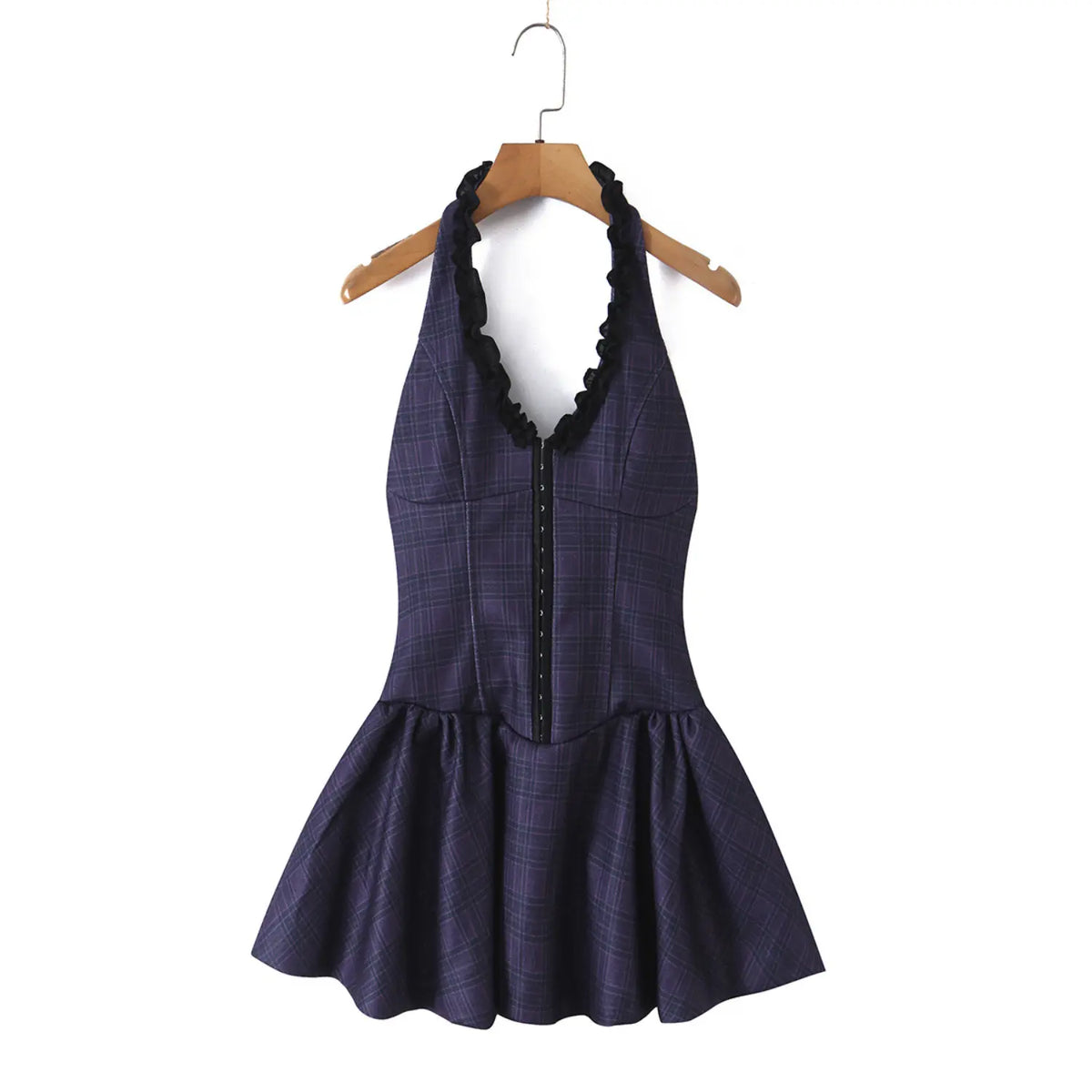 Full view of navy plaid halter mini dress with black ruffle trim, corset front and flared skirt hanging on wooden hanger