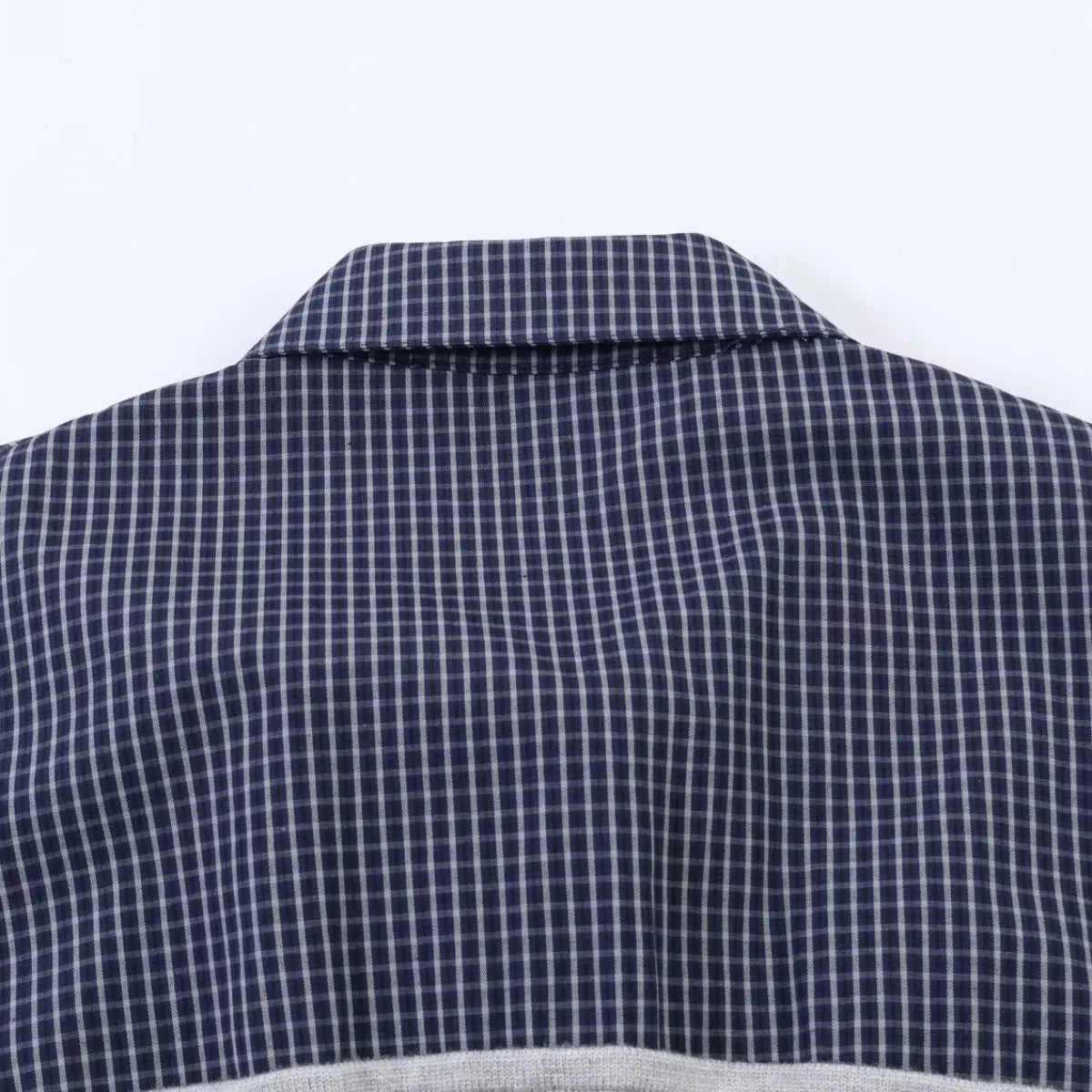 Back view of the navy plaid shirt, showing the structured collar and check pattern