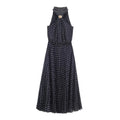 Front view navy blue polka dot halter maxi dress, sleeveless pleated long dress with gold metal ornament