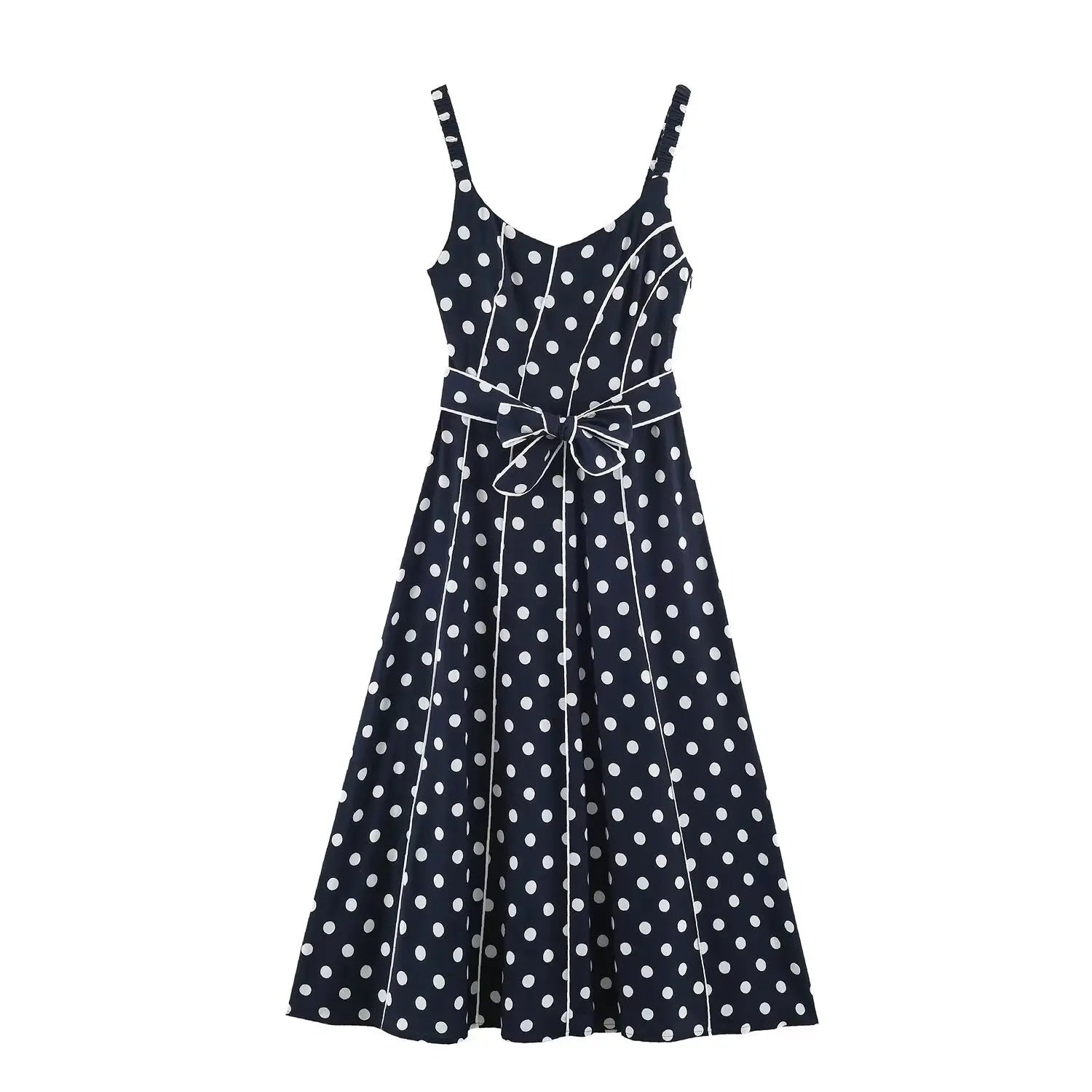 Flat‑lay front view of navy blue polka dot maxi dress, smocked spaghetti straps, v‑neck, waist bow tie, contrast white piping, a‑line maxi skirt