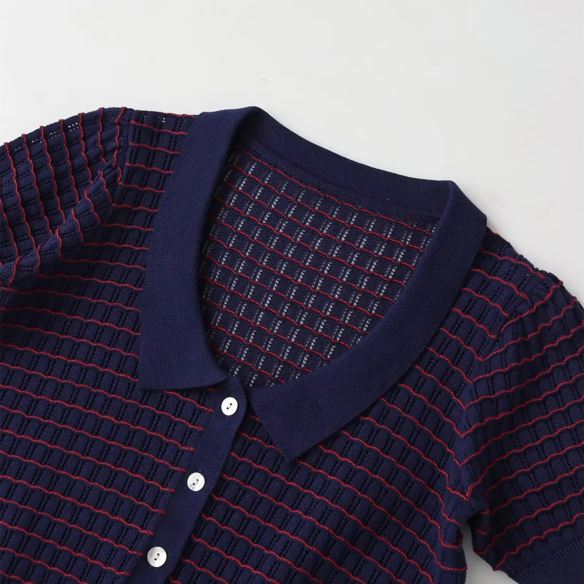 Front view of navy and red striped knit cardigan, showing the polo collar and button placket