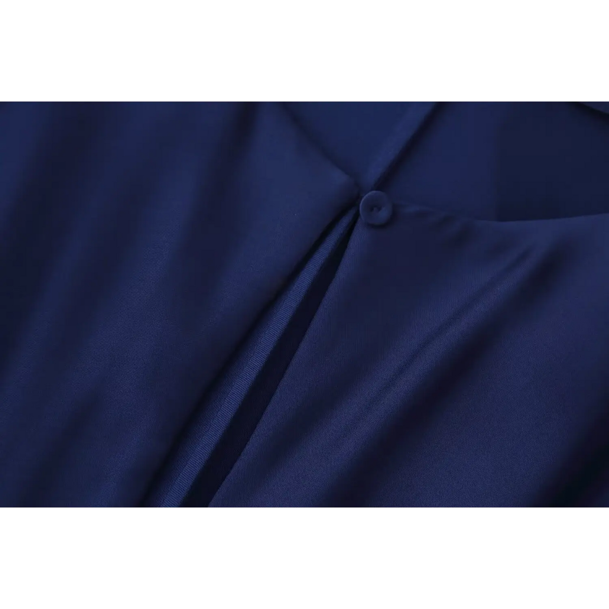 Close-up of back neck button and keyhole slit