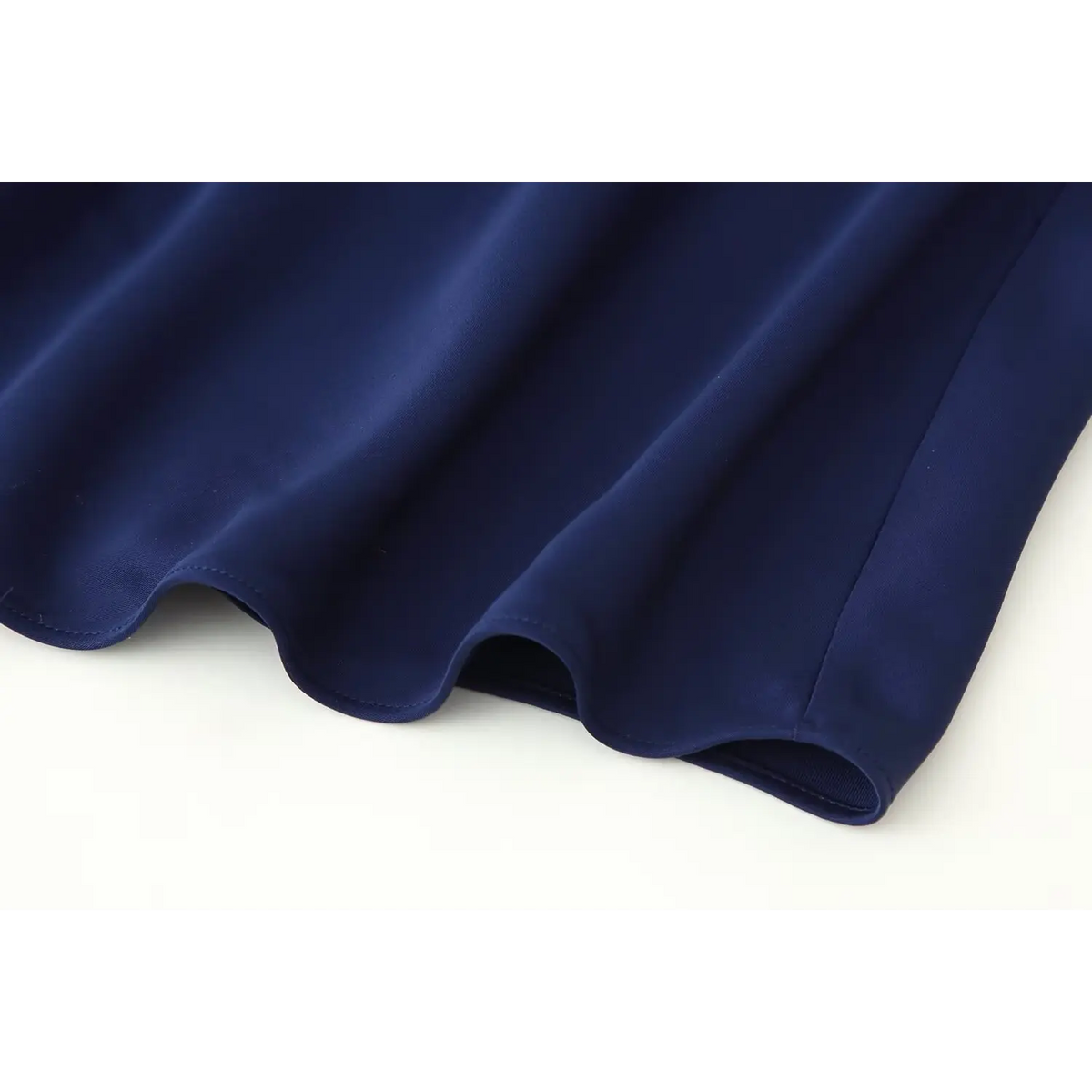 Close-up of fitted skirt hem