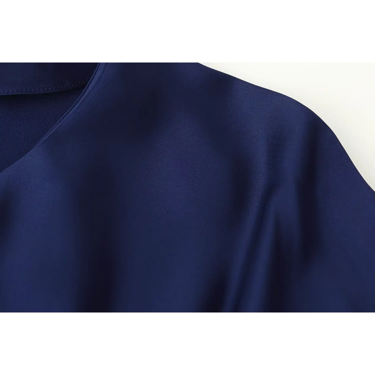 Close-up of shoulder and round neckline