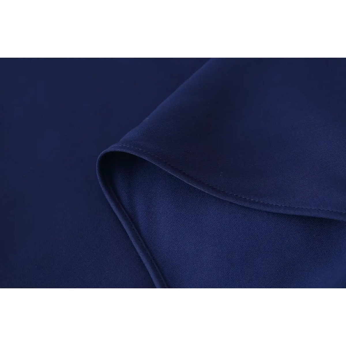 Close-up of satin skirt drape and seam