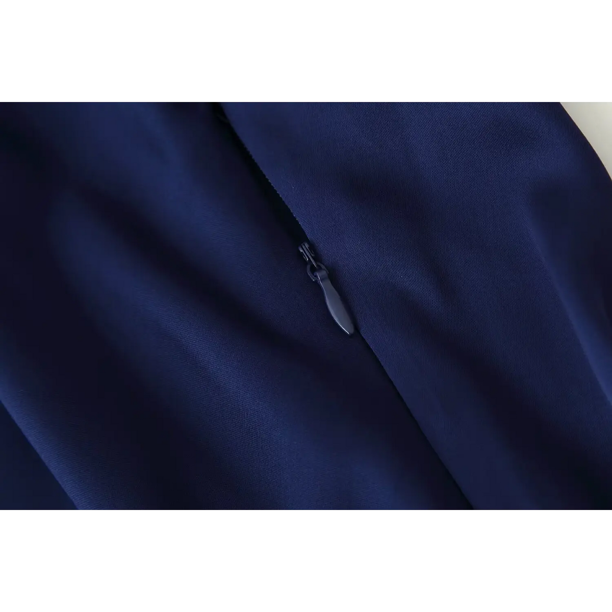 Close-up of back zipper on satin dress