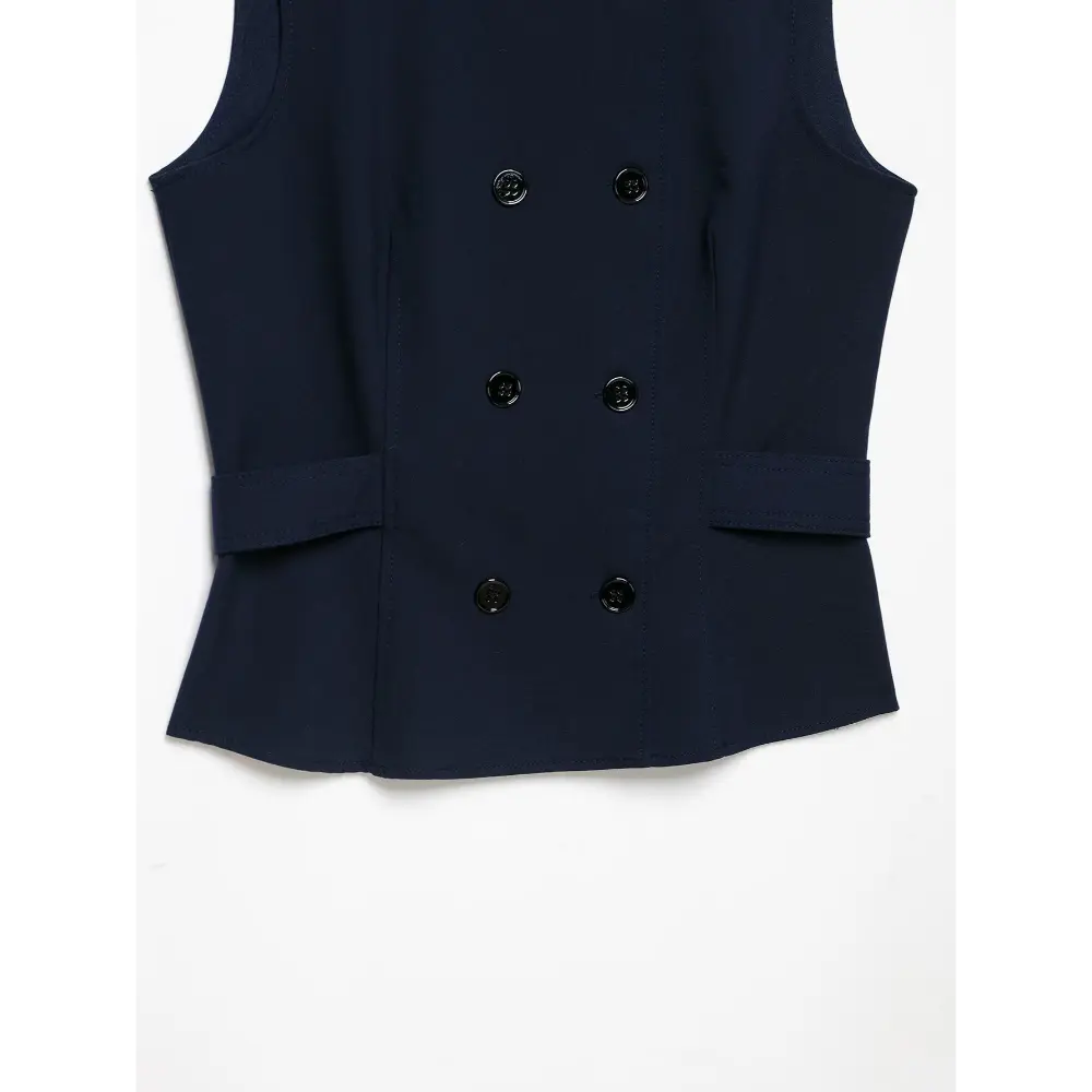 Close-up of double breasted buttons and waist tabs flat lay