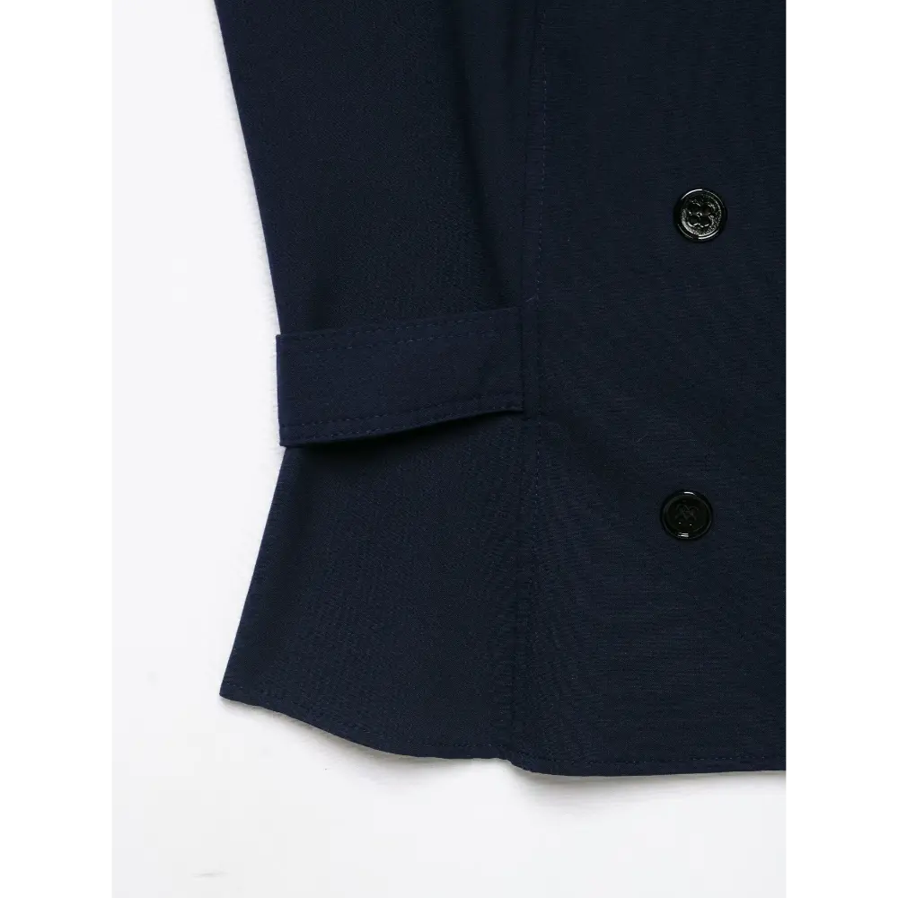 Close-up of side waist tab and hem