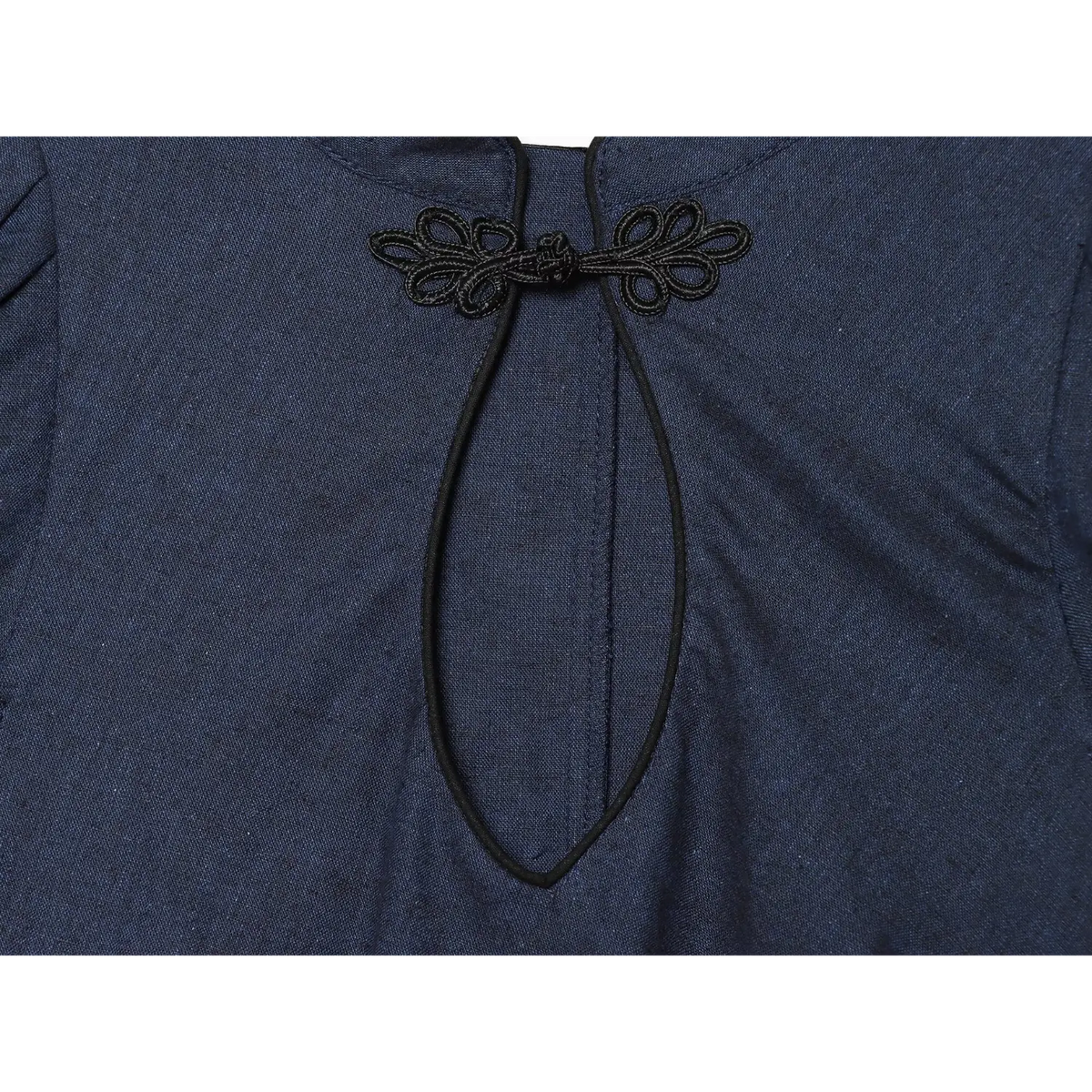 Close‑up of black frog button and keyhole neck detail on navy blue new chinese style mini dress