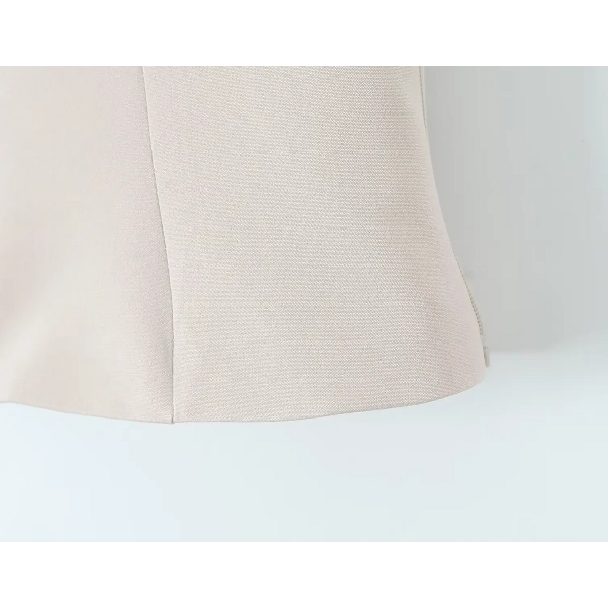 Close-up of ivory hem finish