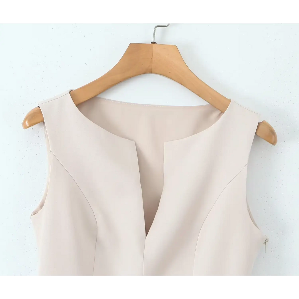 Close-up of ivory notched split neckline hanging