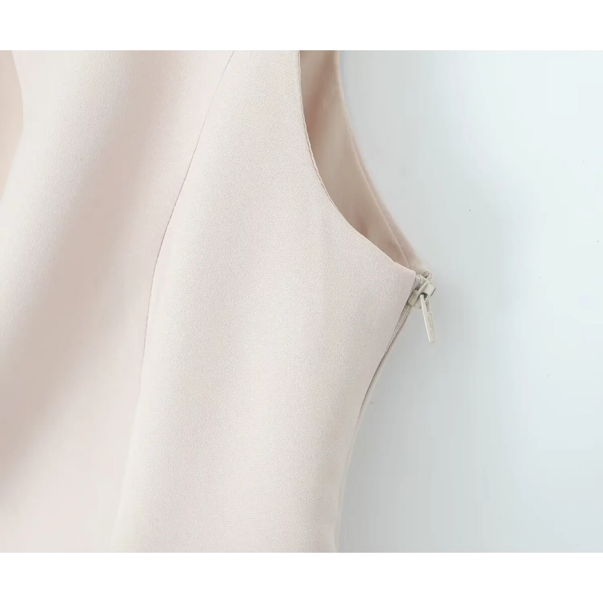 Close-up of ivory side zipper