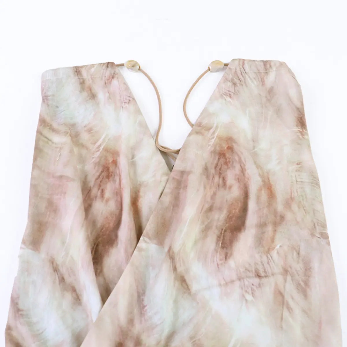 Back view of the nude tie-dye dress straps, showing the adjustable elastic ties and beads