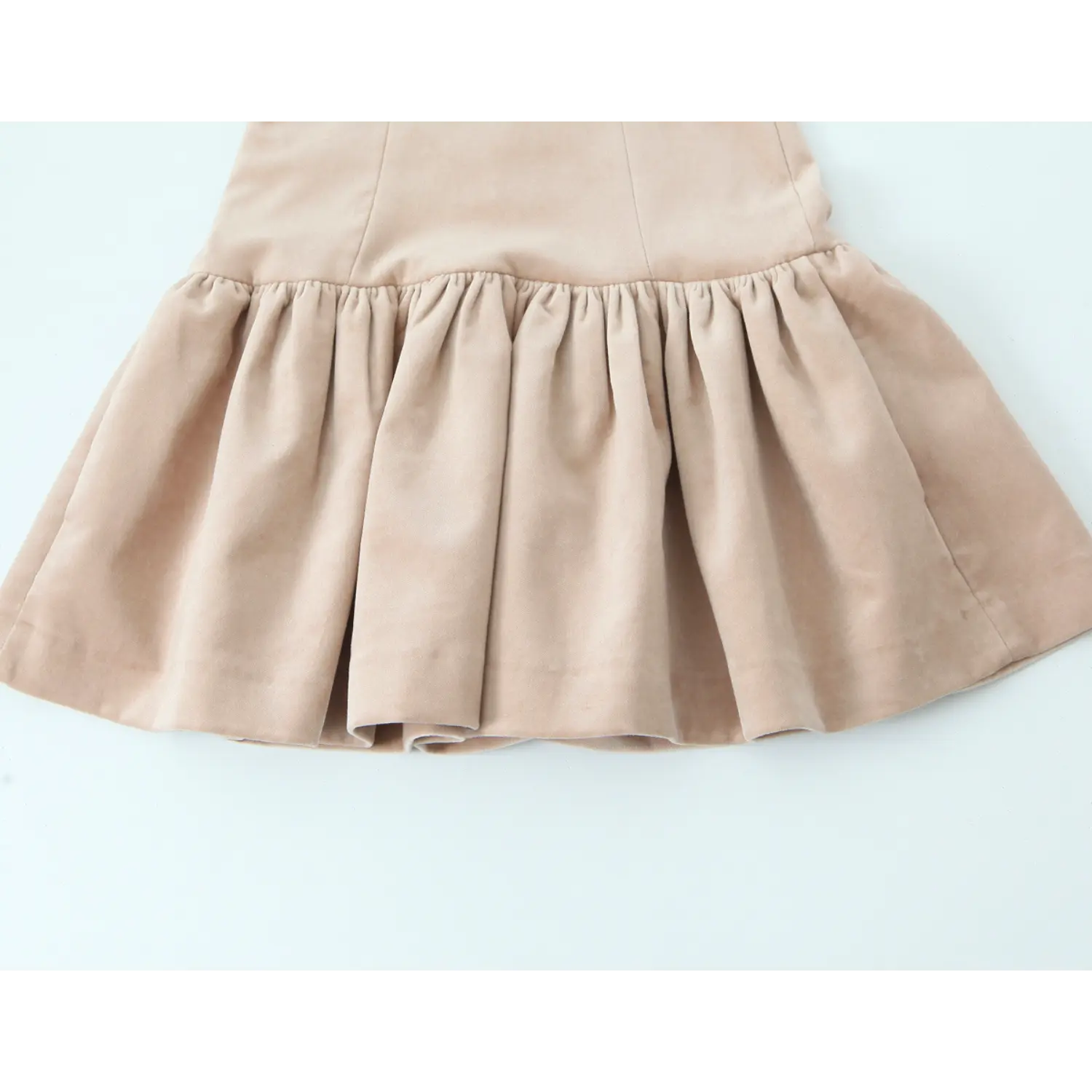 Lower skirt full panel, dense uniform gathering at waist seam, multi-panel flared mini skirt with soft velvet drape