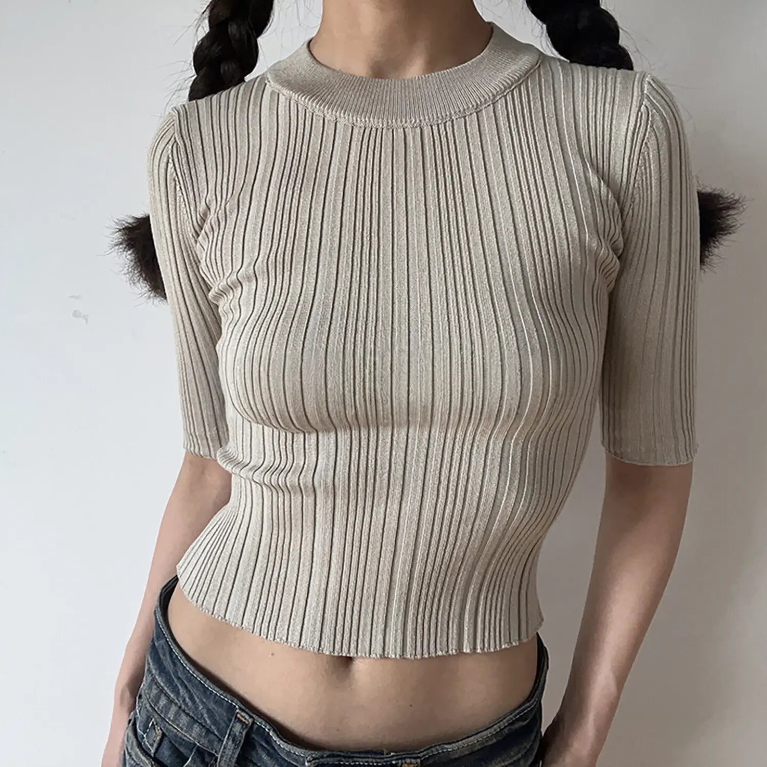 Model front view, oat beige crew neck mid sleeve ribbed knit crop top, bodycon cropped knit top