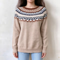 Female model wears oat beige fairisle pullover, vintage geometric jacquard on yoke, crew neck relaxed fit knit sweater, front