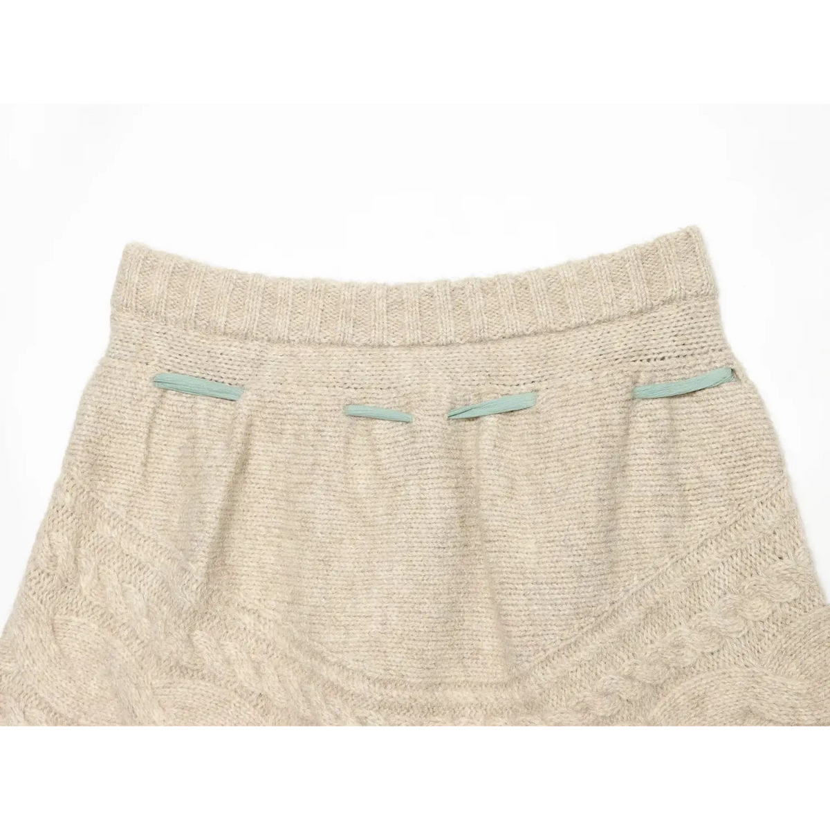 Full back view of oat cable knit skort, four mint ribbon pocket trims, high waist A-line silhouette