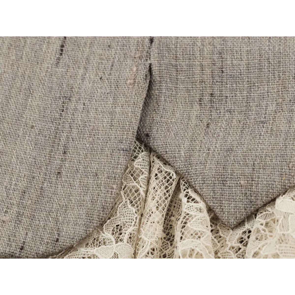 Close-up of hem vent and lace panel