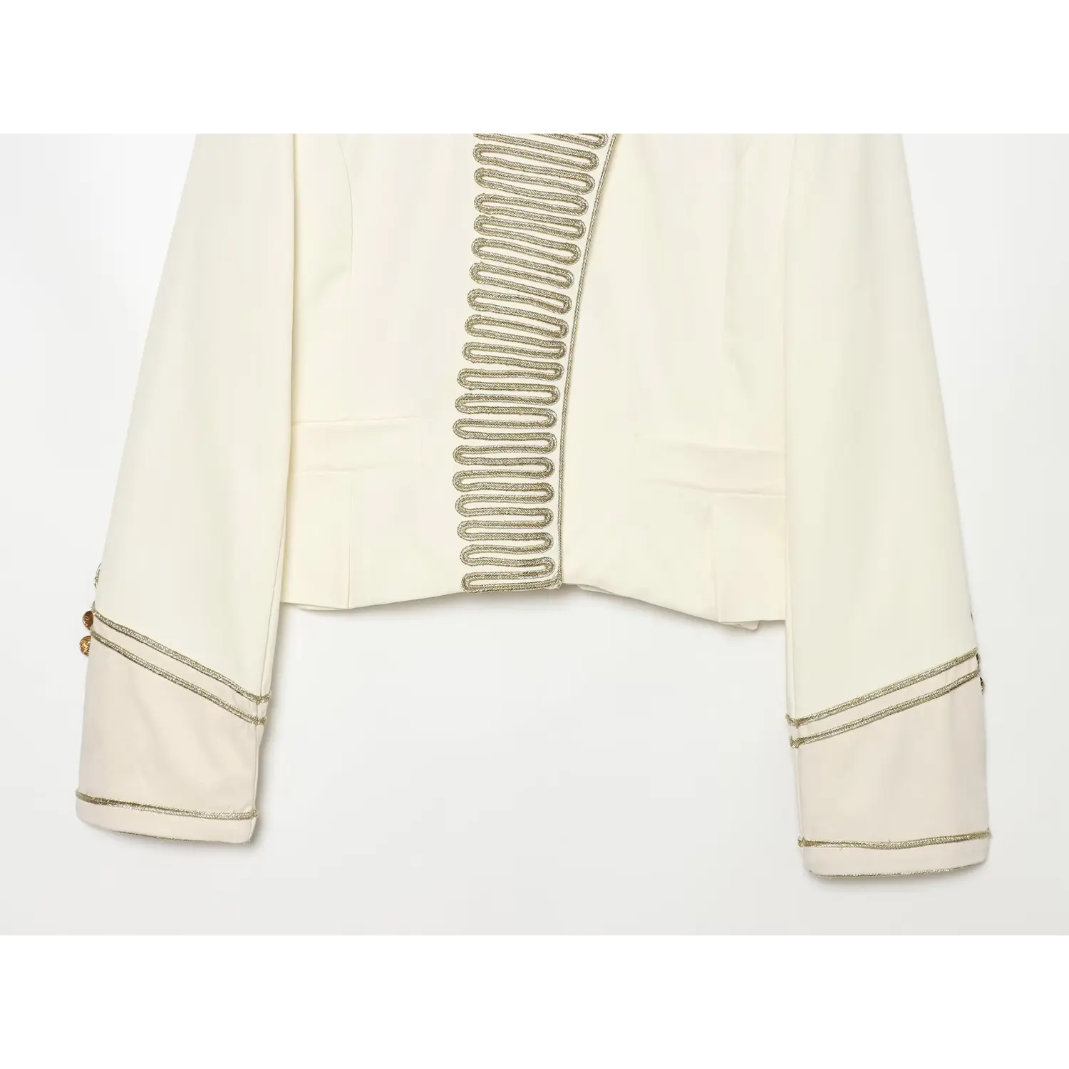 Front pocket and sleeve detail of women tailored cropped jacket, double gold piping on cuffs