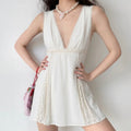 Model wearing off‑white deep v neck lace trim sleeveless vintage mini dress