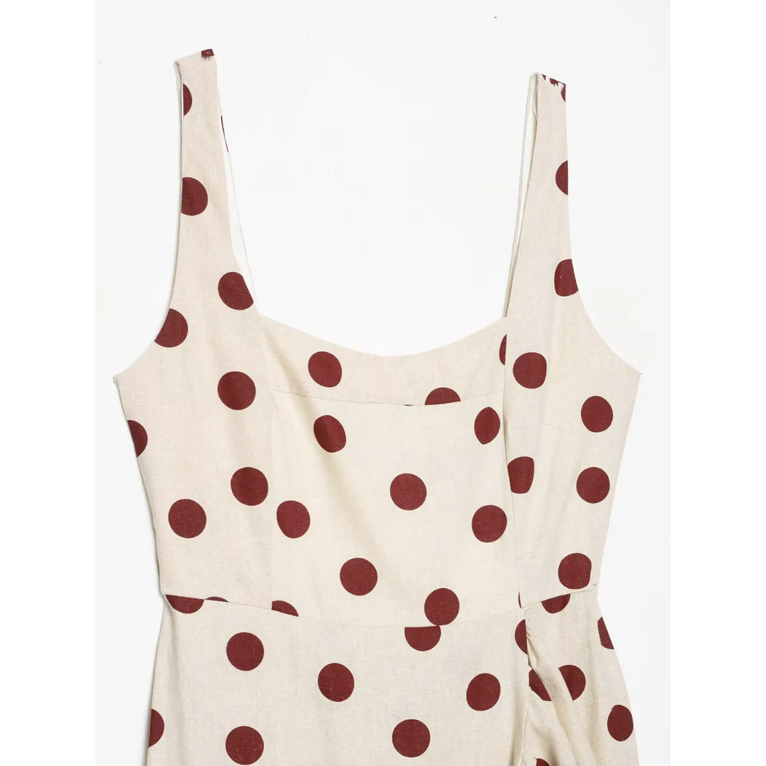 Close-up front shot of square neck bust area on off-white linen cami dress with wine red polka dot print