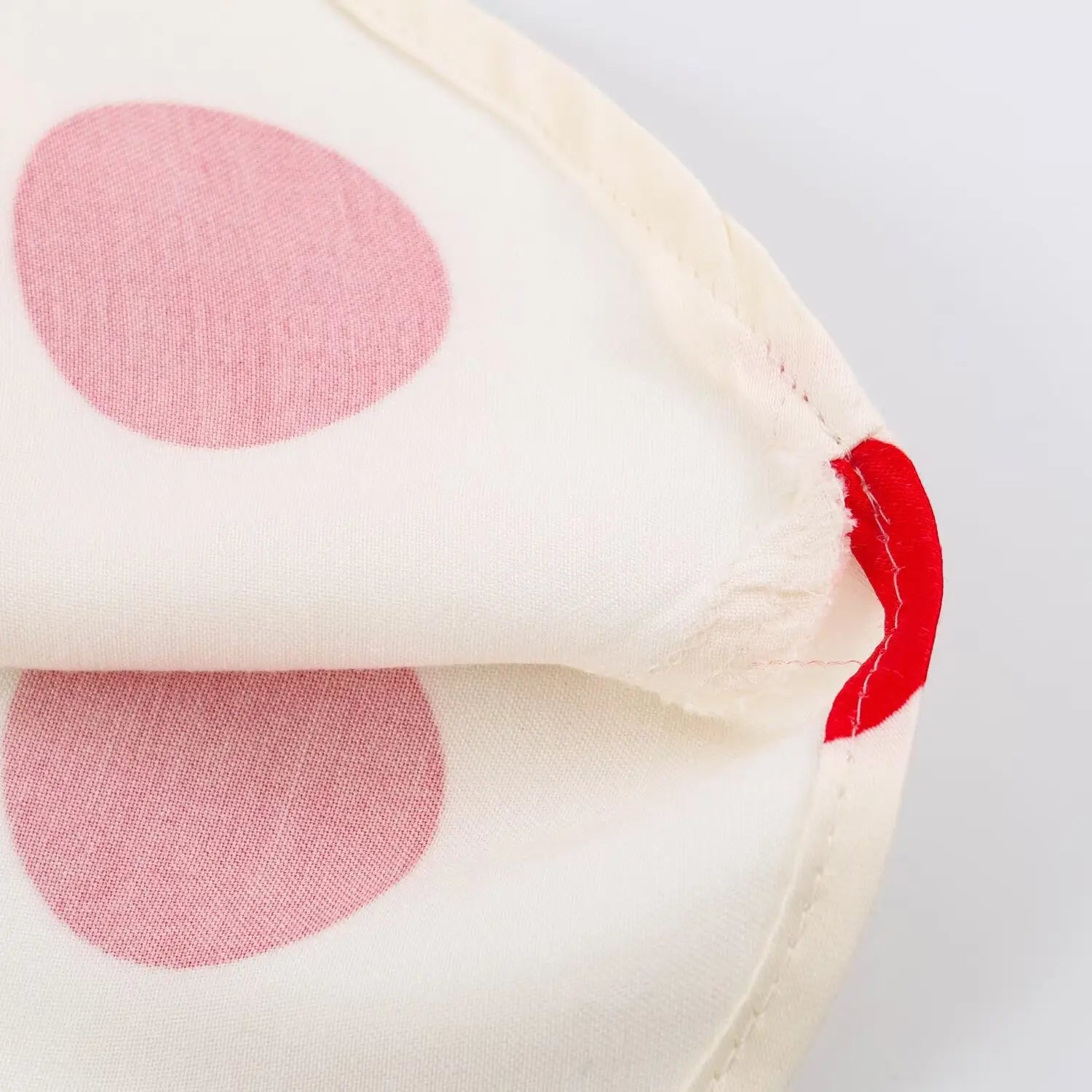 Close‑up of soft inner lining fabric of polka dot halter dress