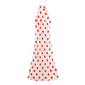 Front full view of off‑white halter maxi dress with large red polka dot print