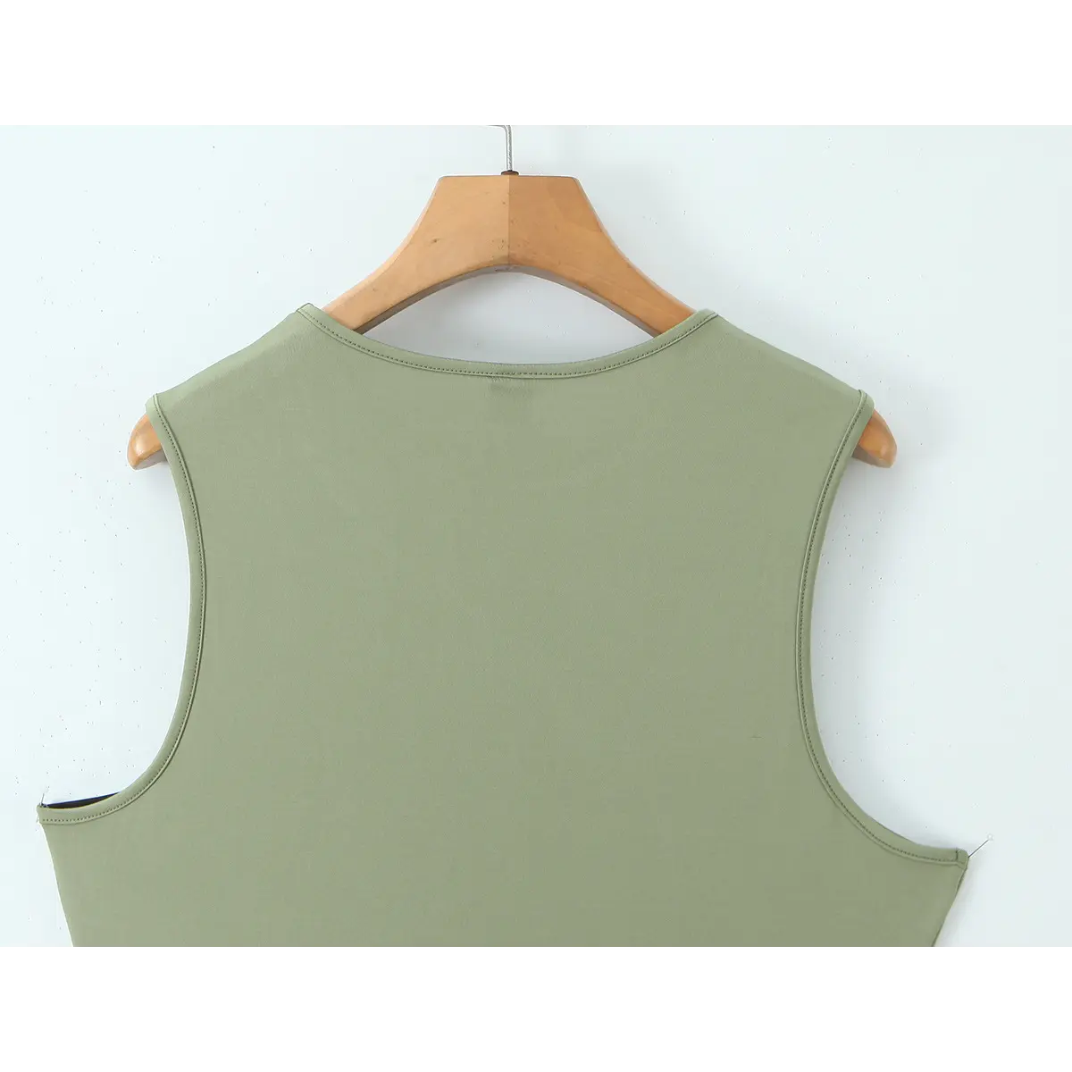 Close-up back view of the tank top, showing the round neckline and clean armhole stitching.