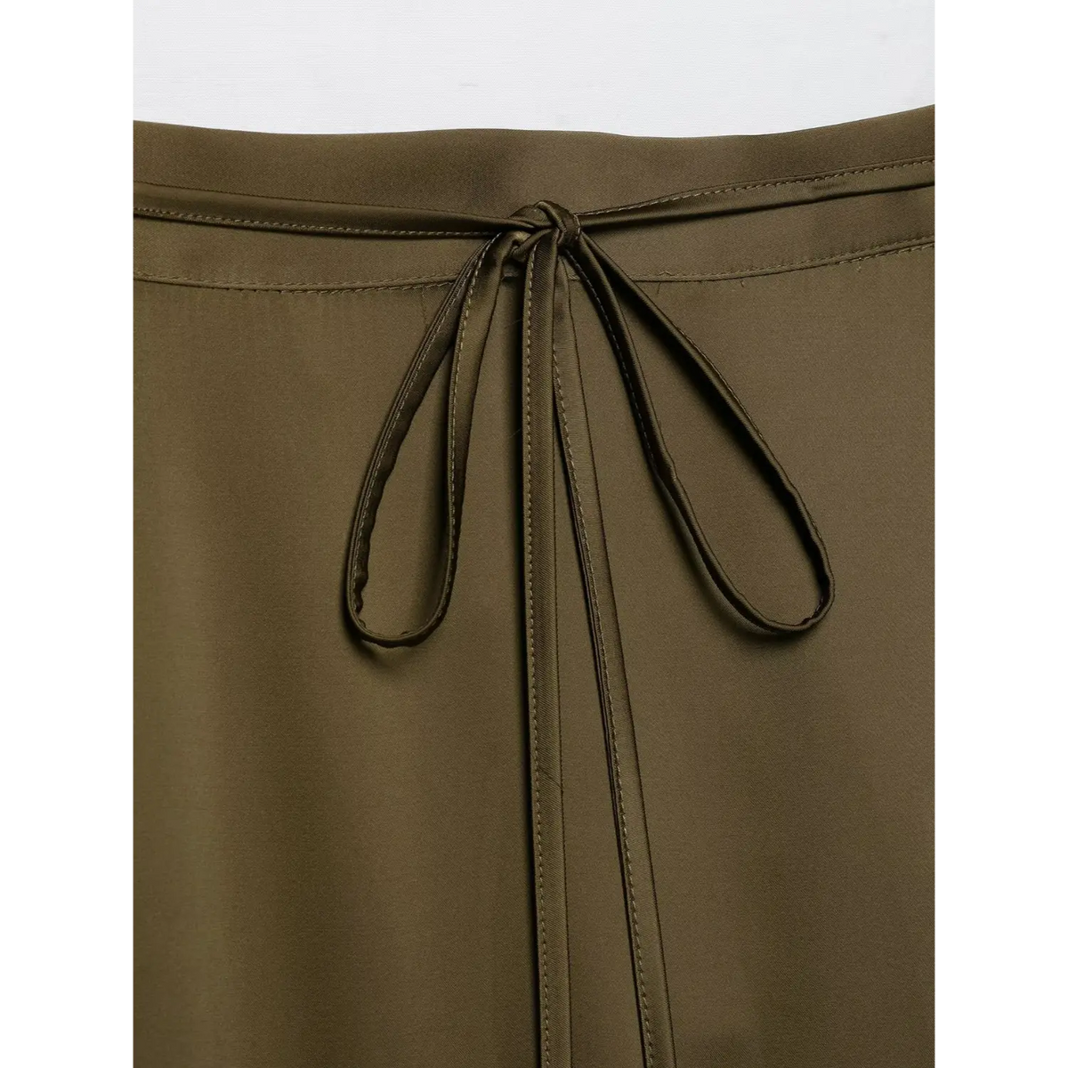 Close-up of tie knot and stitched seam