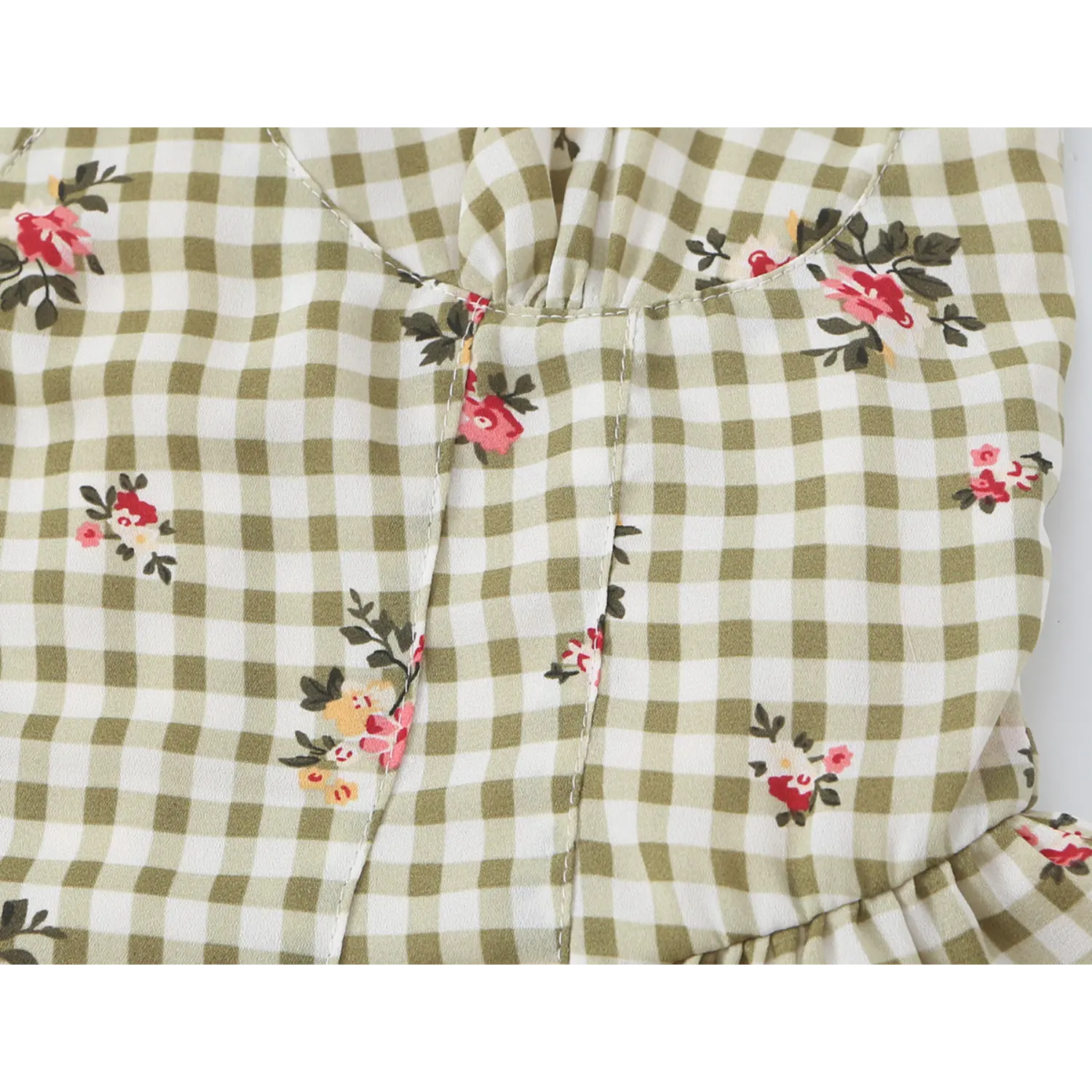 Close up waist seam detail olive white gingham floral camisole, vertical shaping stitching, red floral print, fitted corset waist construction