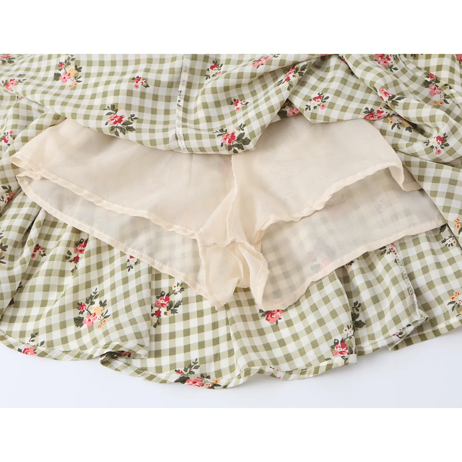close up built-in beige lining shorts of olive gingham pink floral mini dress anti-chafing inner short fabric shot