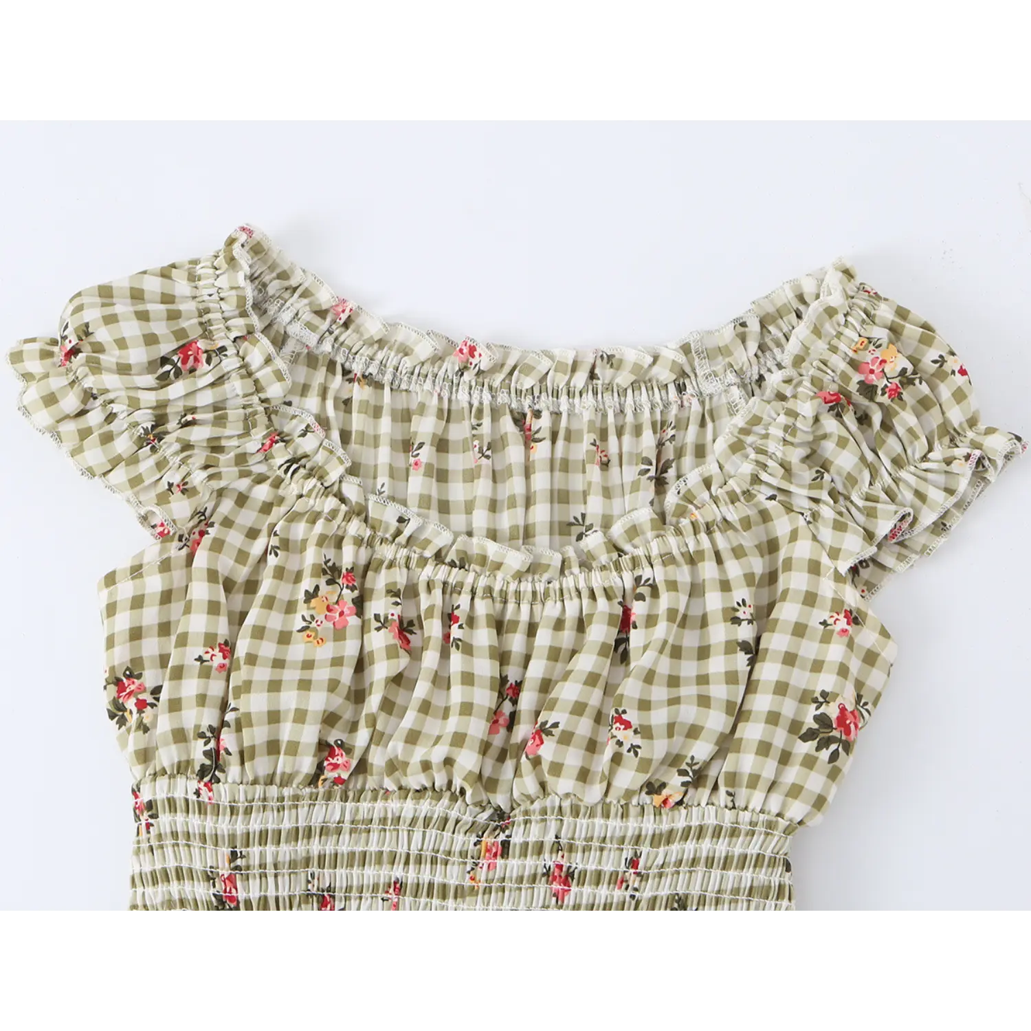 close up of square ruffle elastic neckline and cap sleeve on olive gingham pink floral summer mini dress