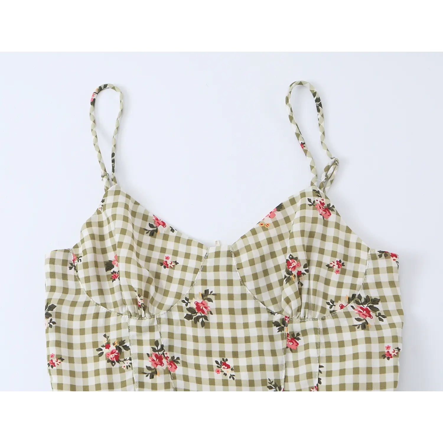 Front flat lay studio shot olive white gingham floral print camisole, sweetheart neckline adjustable thin straps, fitted waist flared peplum ruffle hem women summer top