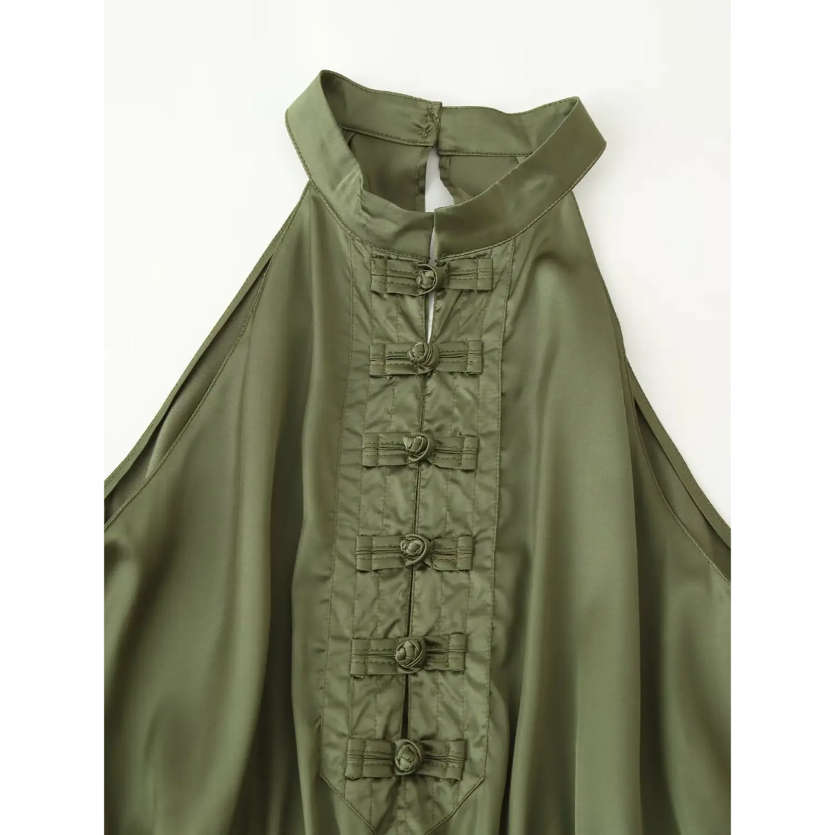 Close-up of halter collar and frog buttons