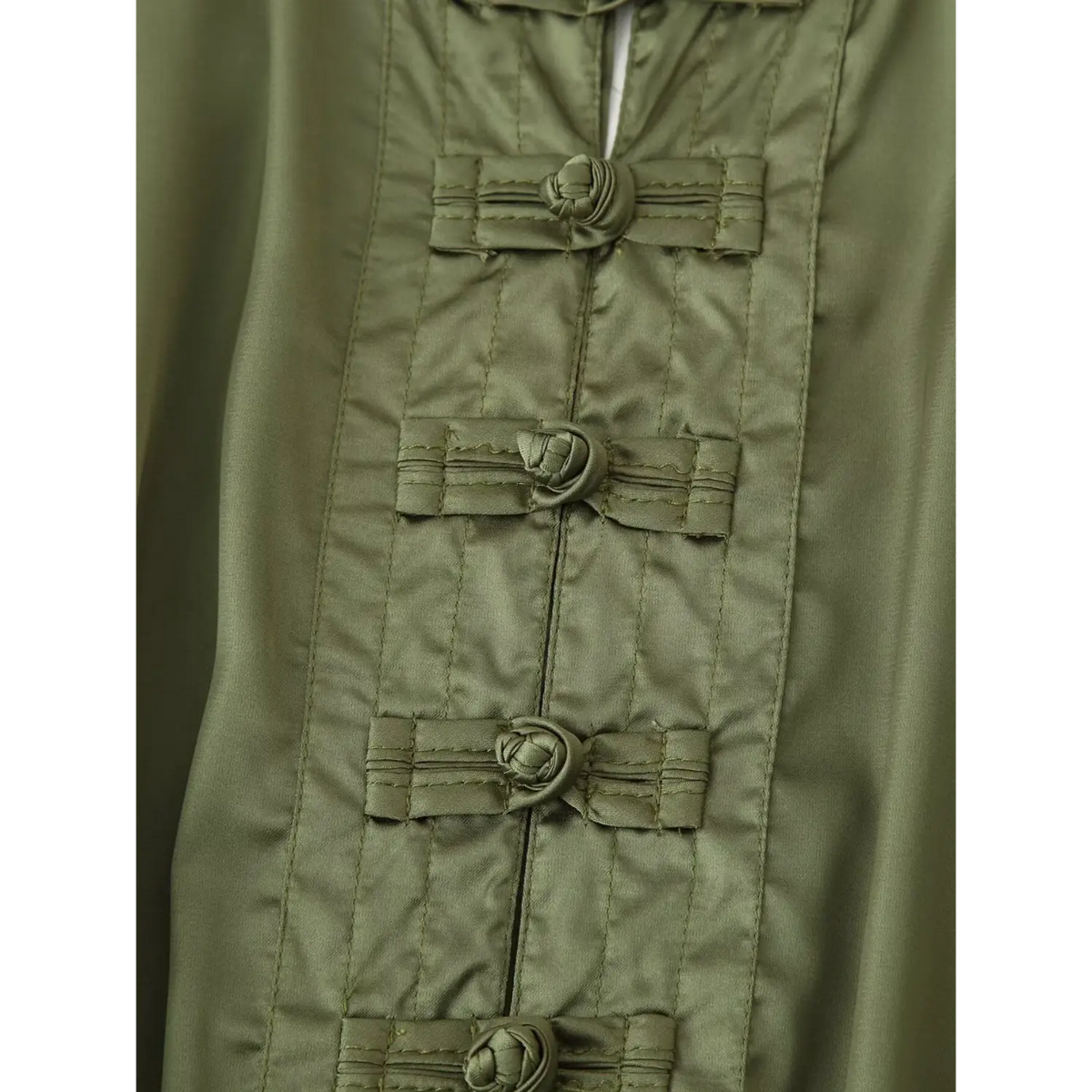 Close-up of Chinese frog button detail