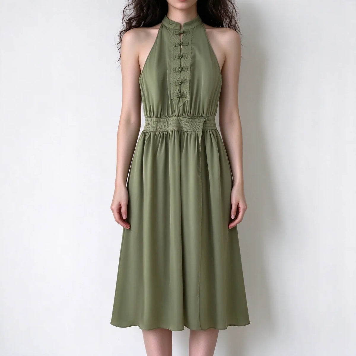 Model wearing olive green Chinese frog button halter midi dress, front view