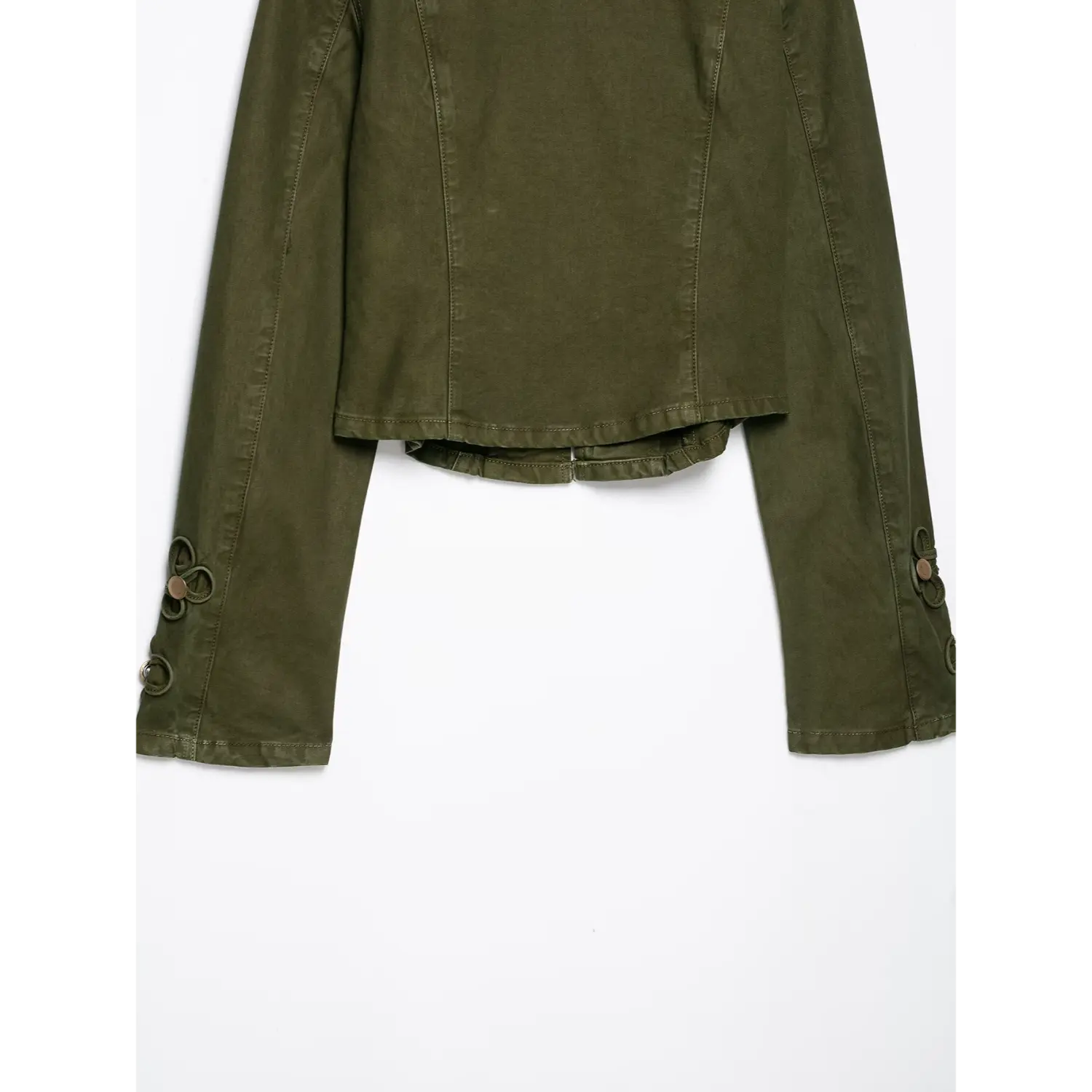 Back bottom partial view of olive green cropped military jacket, vertical seam stitching, decorative knot‑button cuffs, cropped hem, white background