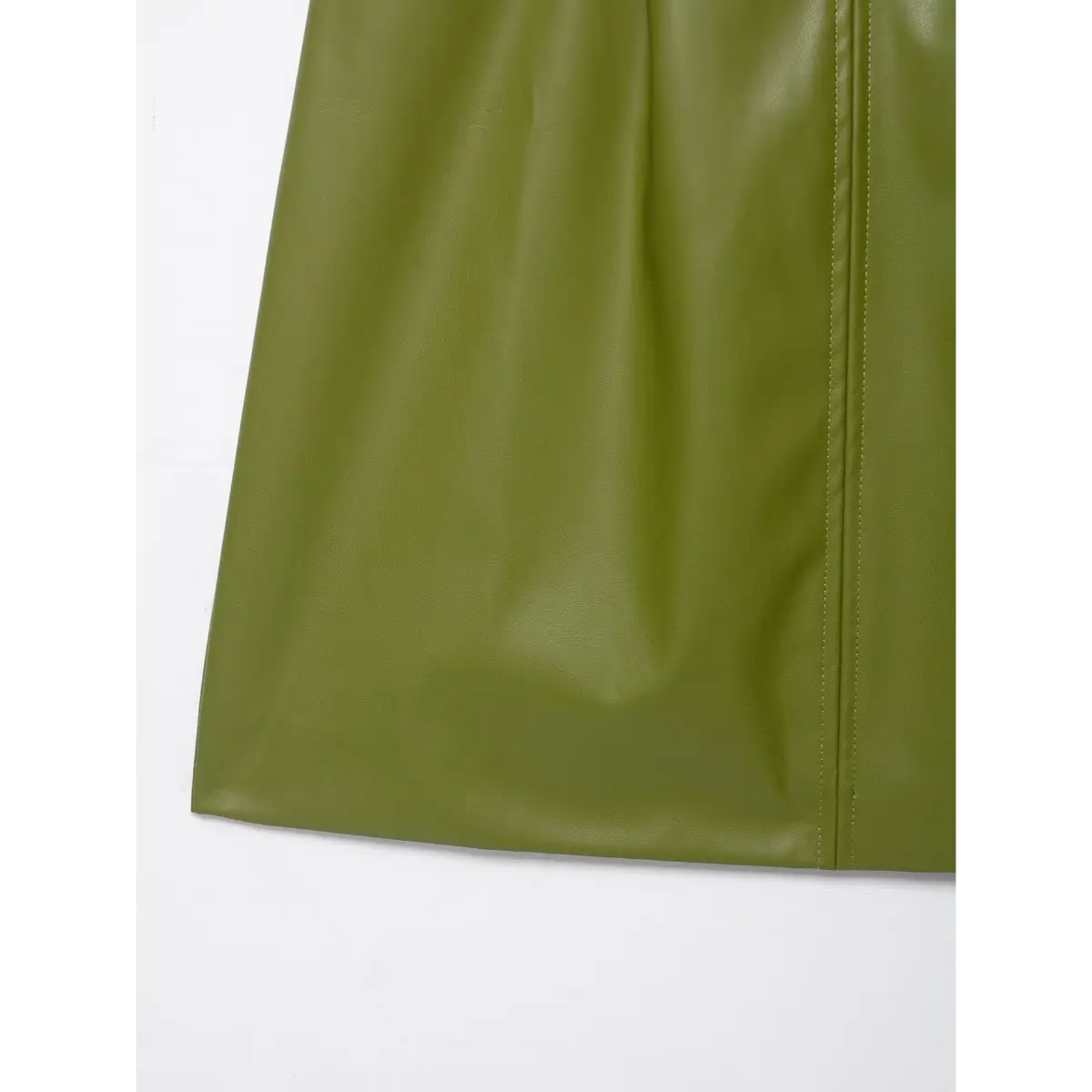 Close-up view of the skirt hem on an olive green faux-leather strapless dress, showing the clean stitching and fabric drape.