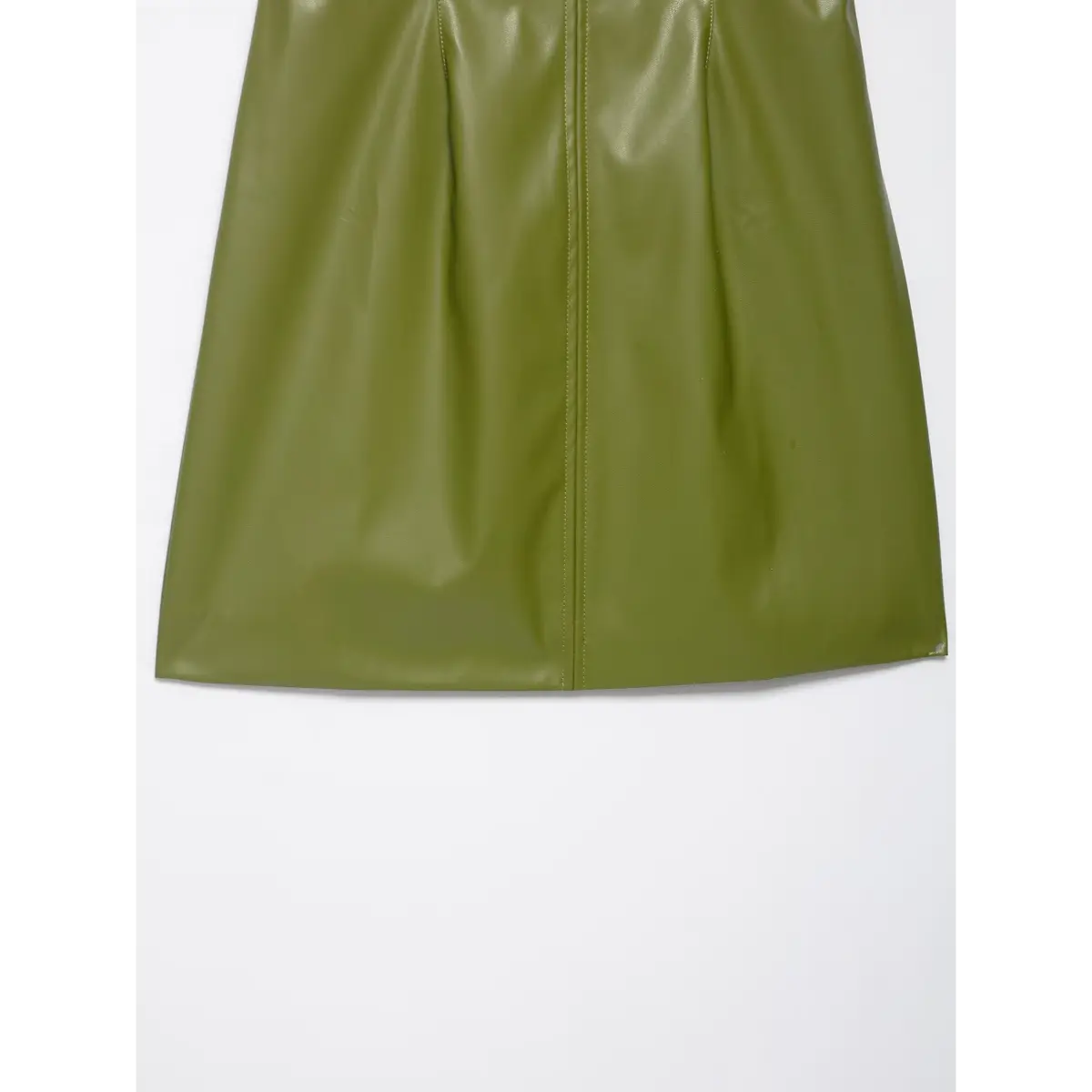 Close-up view of the skirt hem on an olive green faux-leather strapless mini dress, showing the vertical center seam and A-line silhouette.