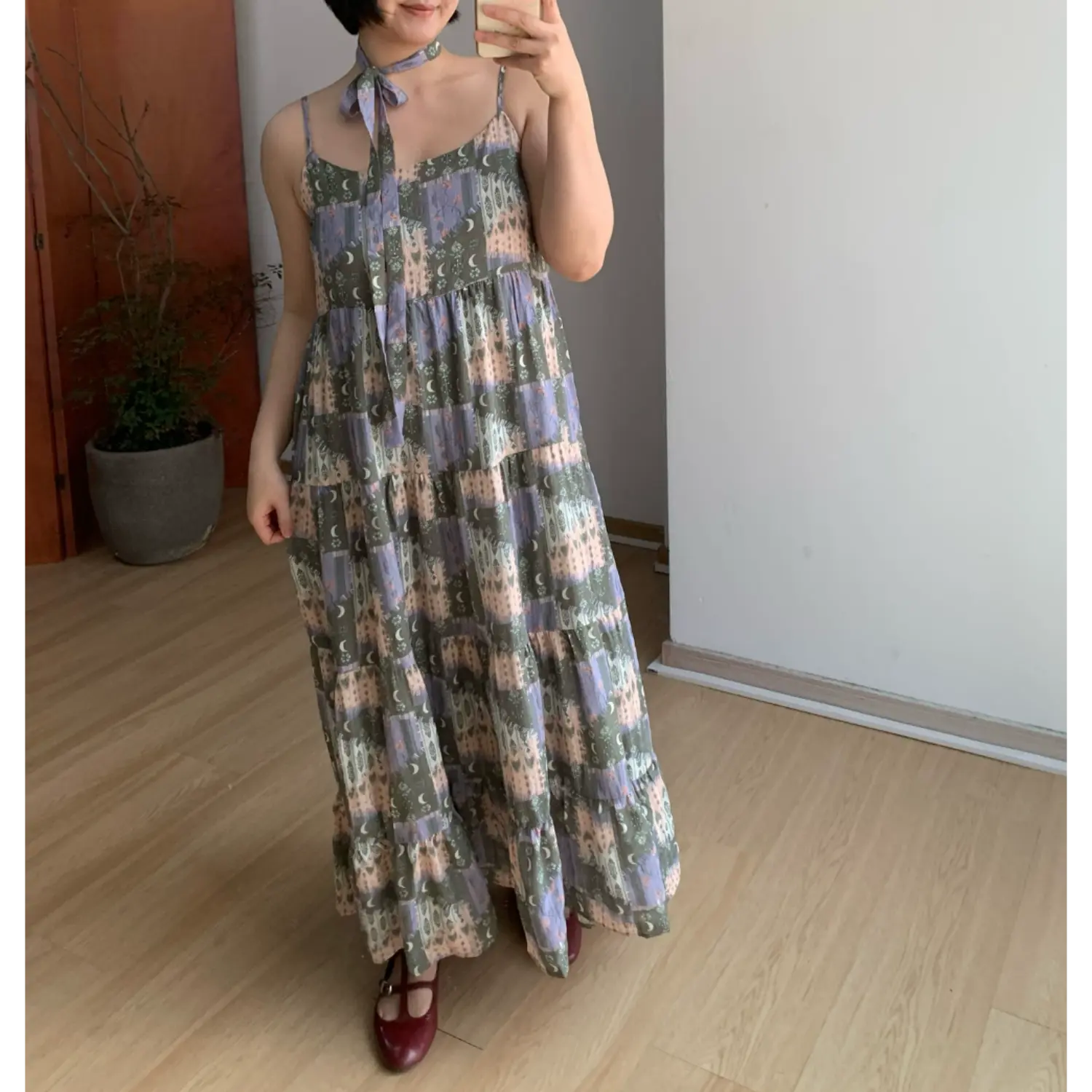 Vintage moon forest print cami tiered maxi dress side front relaxed shot, loose a-line drape chiffon fabric daily indoor full outfit