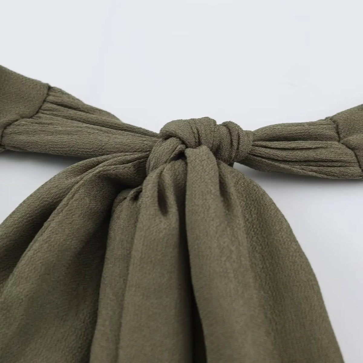 Close-up of halter neck tie knot